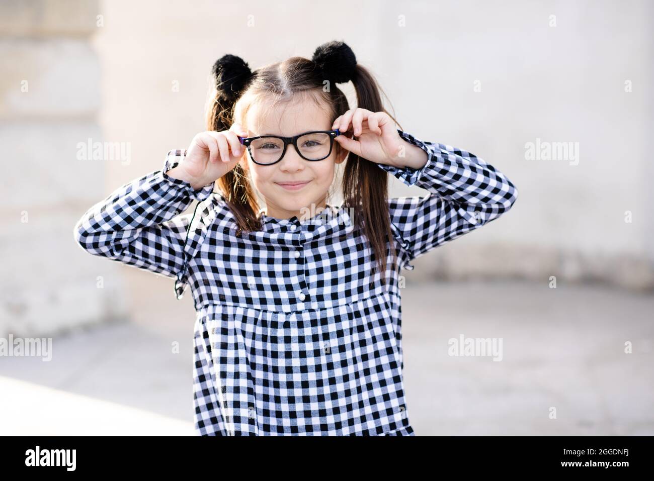 Cute little pupil girl 5 6 year old wear glasses and casual stylish dress. Back to school. Childhood. Sweet toddler having fun outdoors. Looking at ca Stock Photo Alamy