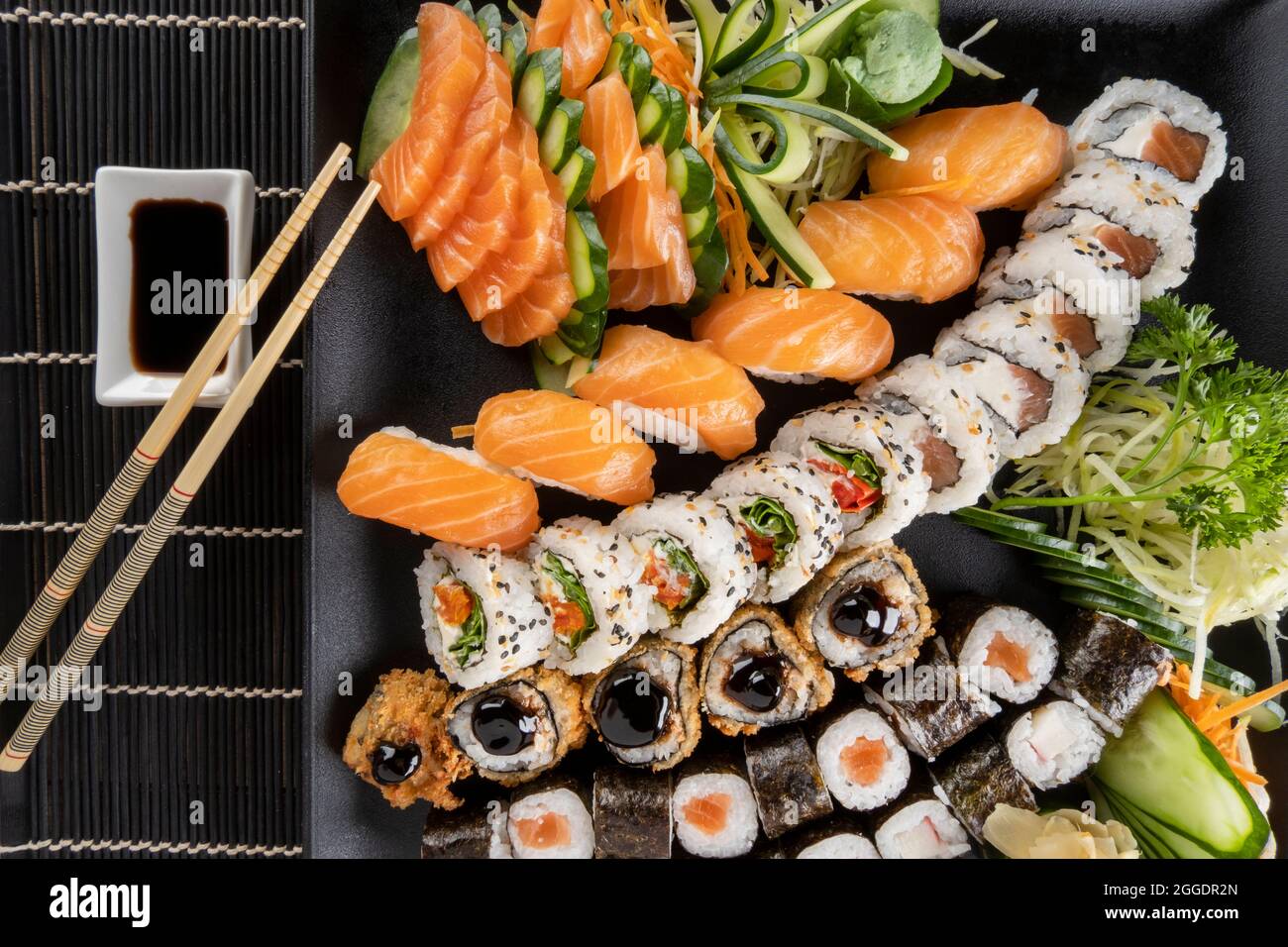 Mixed sushi roll and salmon sashimi Stock Photo Alamy