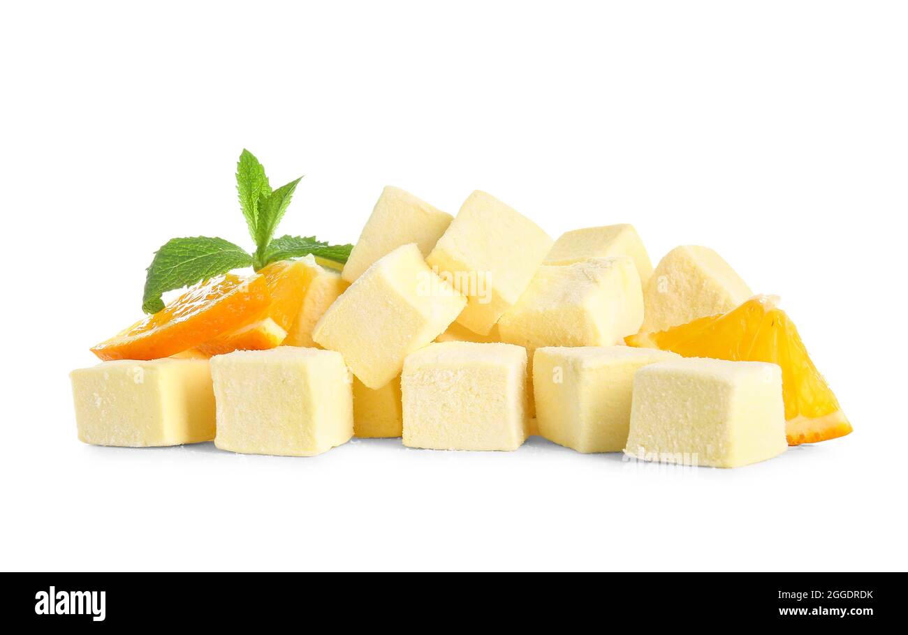 Tasty sweet marshmallows and orange on white background Stock Photo - Alamy