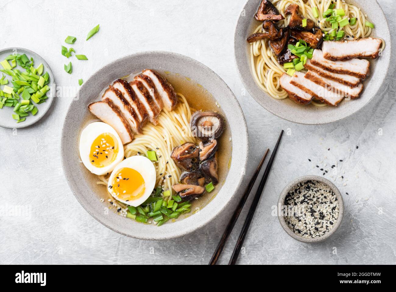 Ramen bowl with pork and egg on grey concrete table background, top view Stock Photo