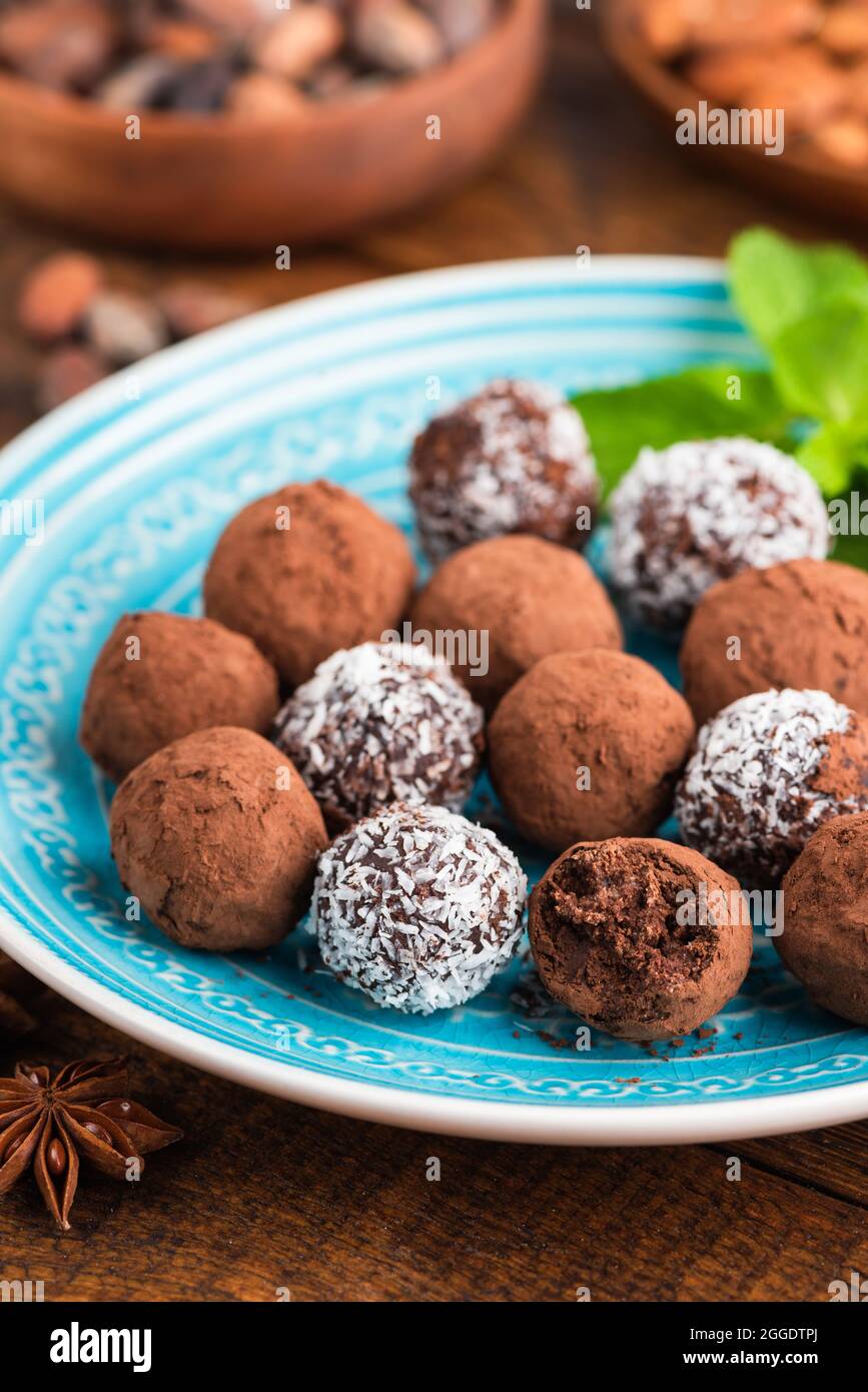 Homemade vegan chocolate truffles with coconut cream coated in coconut
