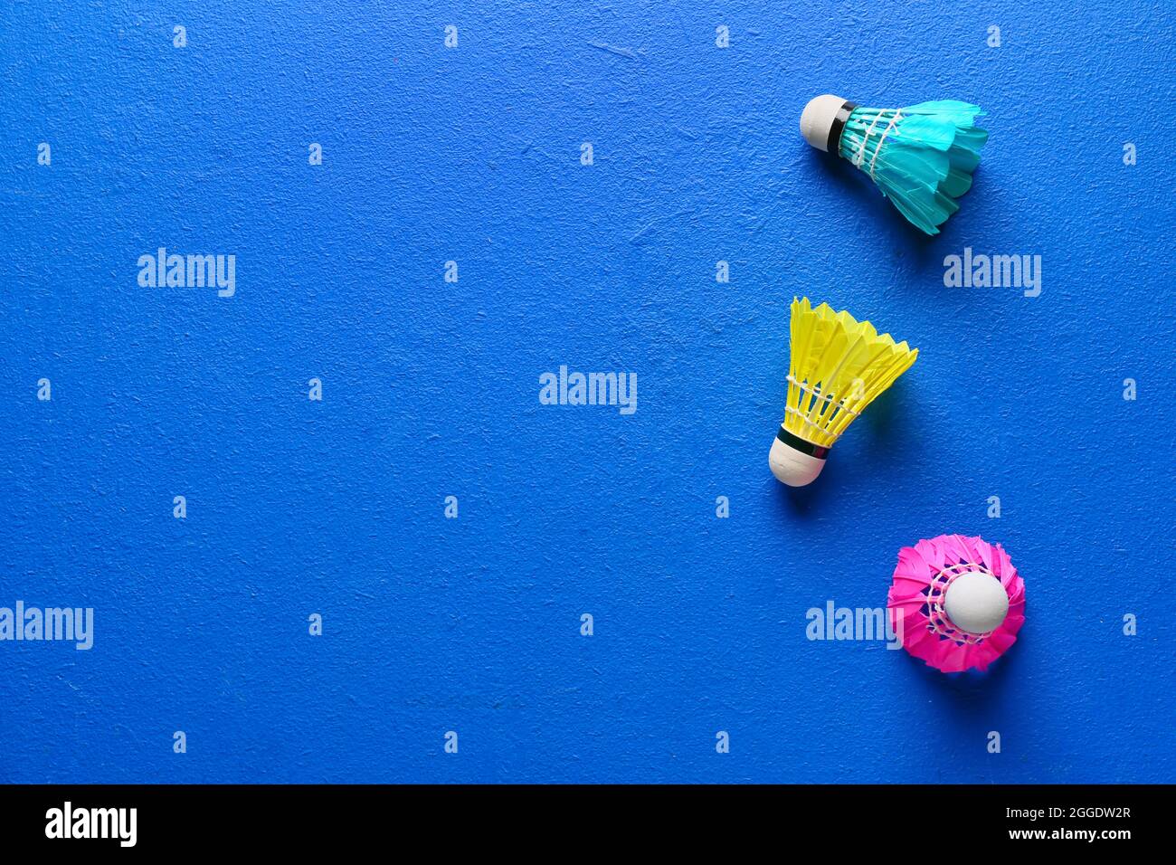 Badminton shuttlecocks on color background Stock Photo