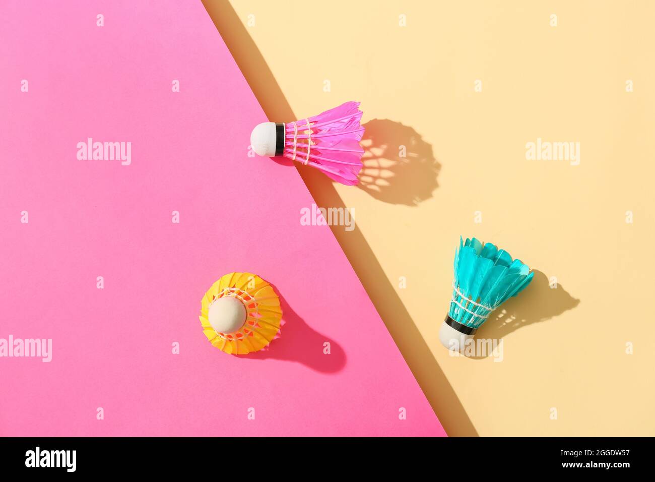 Badminton shuttlecocks on color background Stock Photo