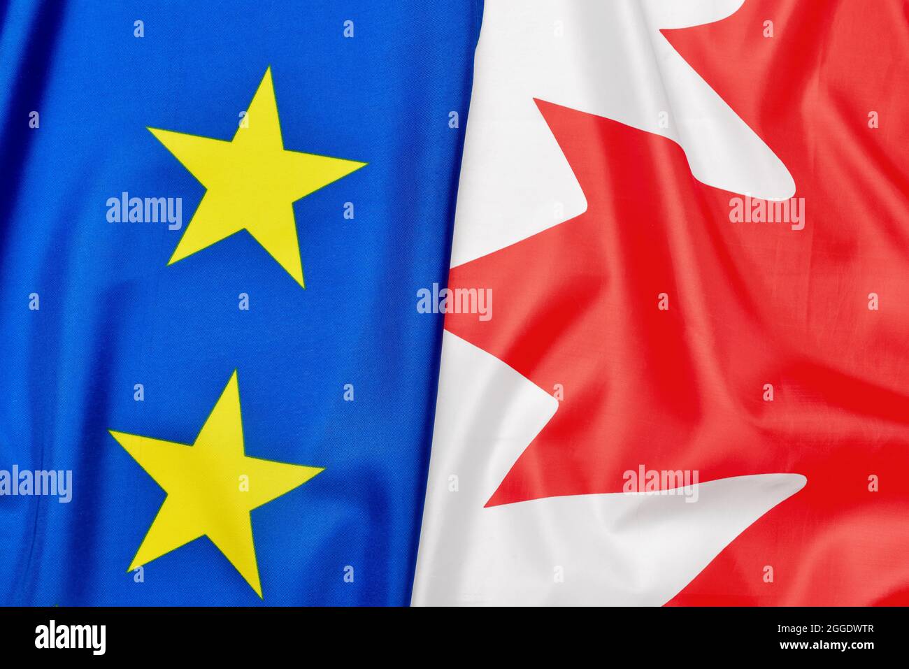 Flags of Canada and European Union as background, closeup Stock Photo