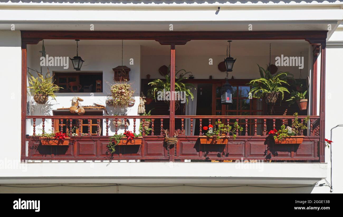 traditional balcony in Arabic style, decorated with many flowers. In the Canary Islands, Santa Brigita, Gran Canaria Stock Photo