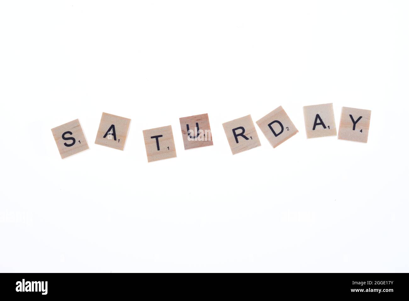 Word saturday arranged from wooden blocks on white background. Stock Photo