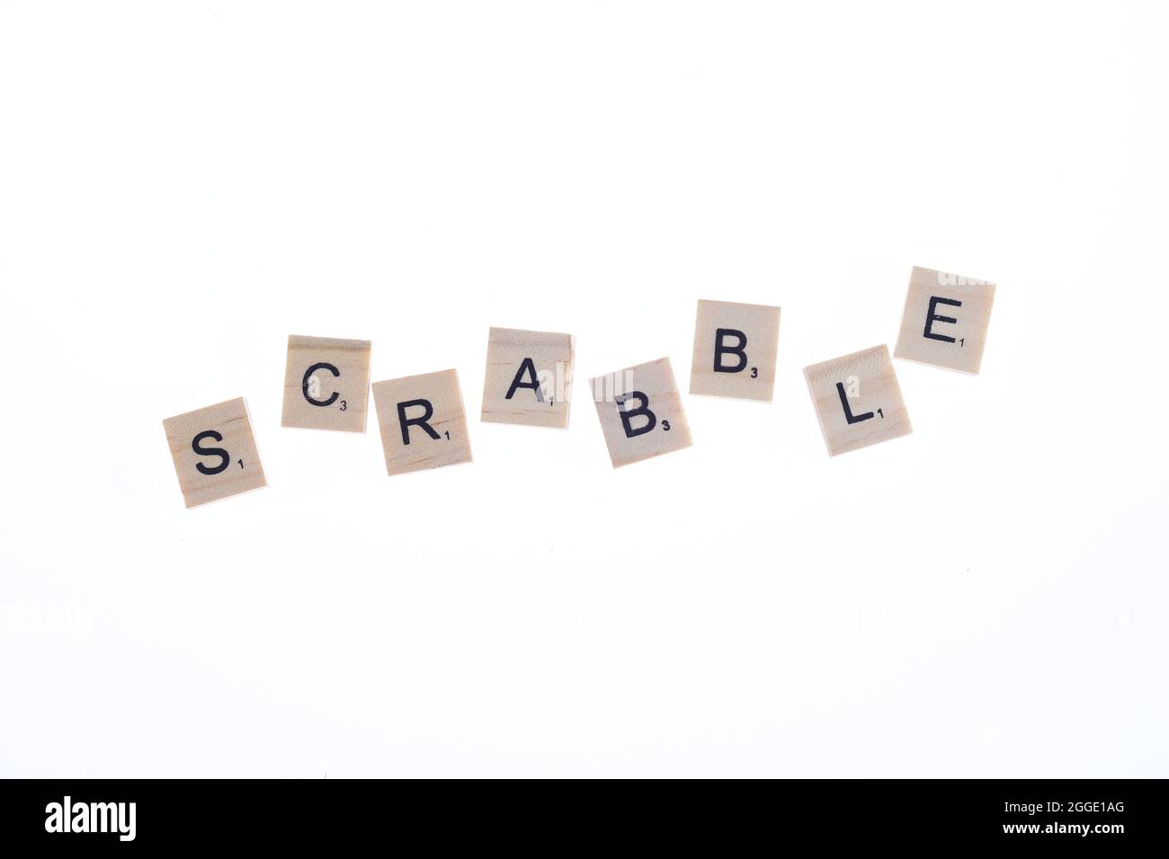 Word scrabble arranged from wooden blocks on white background. Stock Photo