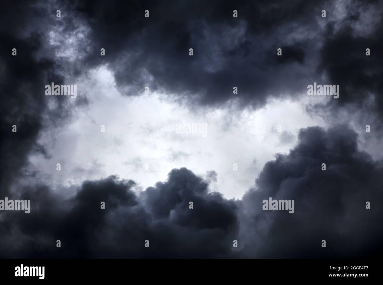 Hole of the Sky in the Dark Storm Clouds Stock Photo
