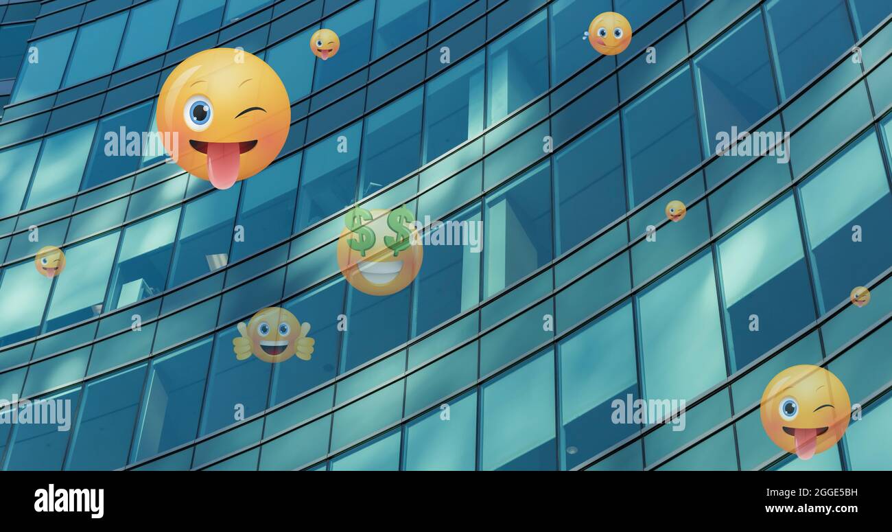 Image of emoji icons flying up over modern office building Stock Photo ...