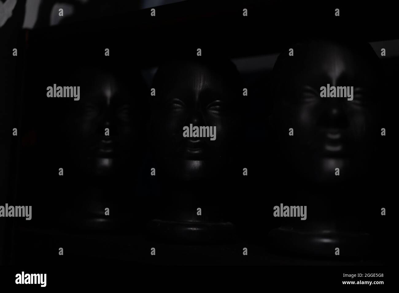 Black mannequin head on black background modern fashion abstract background Dark dummy head