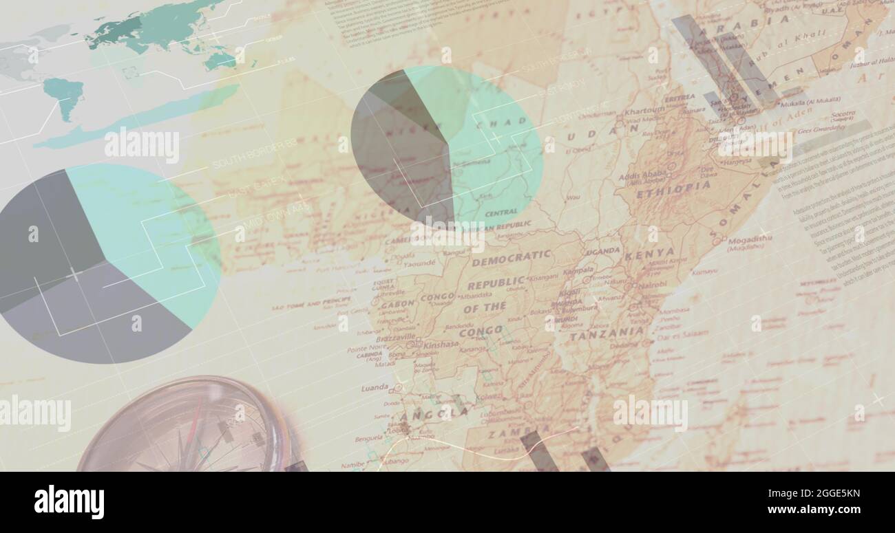 Image of multiple graphs rolling over a compass lying on a map Stock ...