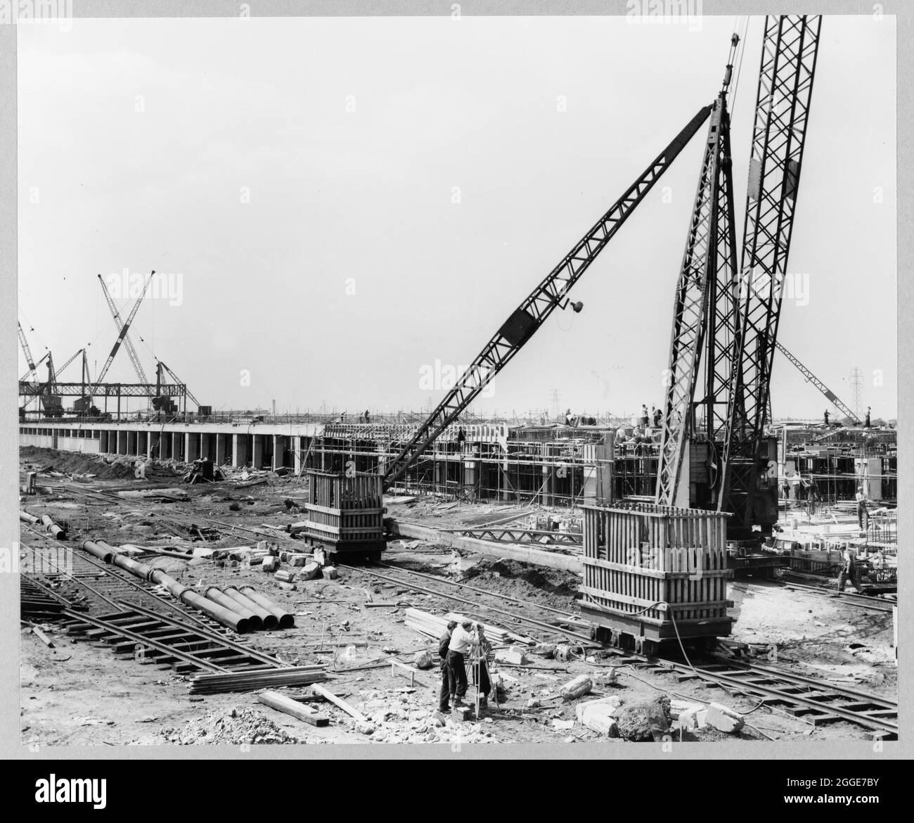 A view of the new foundry under construction at the Ford Motor Company Works, showing the south-east end of the building with reinforcing steel, formwork and concrete pouring in progress. This image was catalogued as part of the Breaking New Ground Project in partnership with the John Laing Charitable Trust in 2019-20. Stock Photo