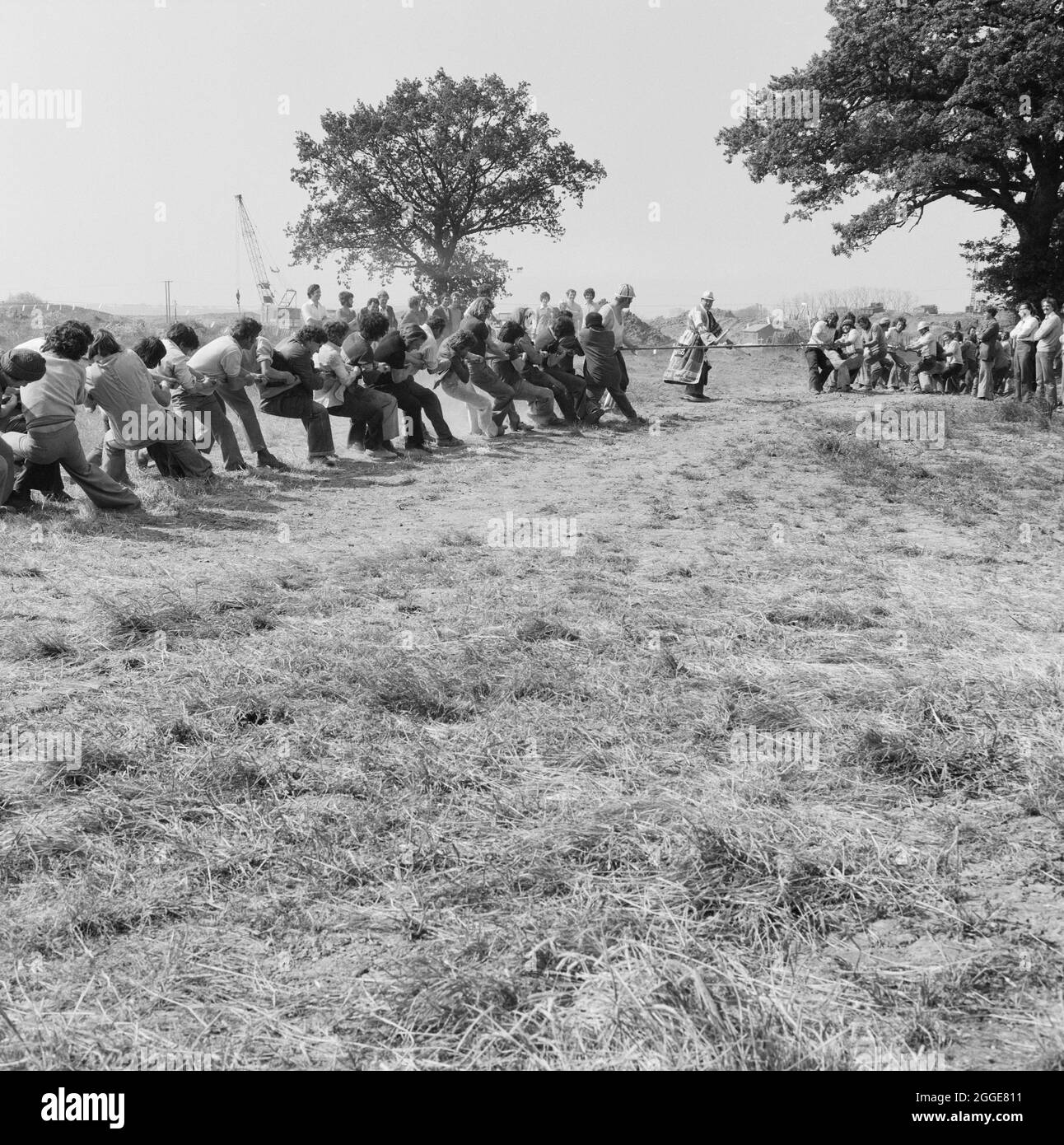 A tug-o-war contest between Laing workers and subcontractors, part of the gala to celebrate the Queen's silver jubilee held at the new Courage Brewery site. A cropped version of this image was used in the July 1977 issue of Team Spirit, the Laing staff newsletter. Stock Photo