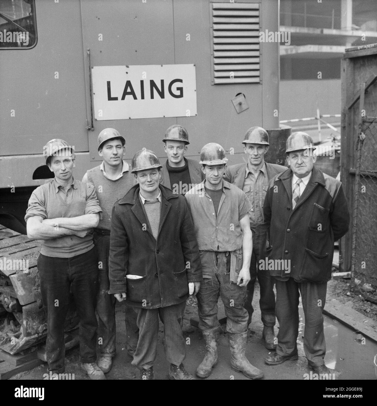 A group portrait of the tunnel team on the Co-operative Society CIS/CWS contract. From left to right; M. Lynch, L. Tague, J. McCabe, M. Mannion, W. Kowalzyk, J. Crabbe and C. White. This image was catalogued as part of the Breaking New Ground Project in partnership with the John Laing Charitable Trust in 2019-20. Stock Photo