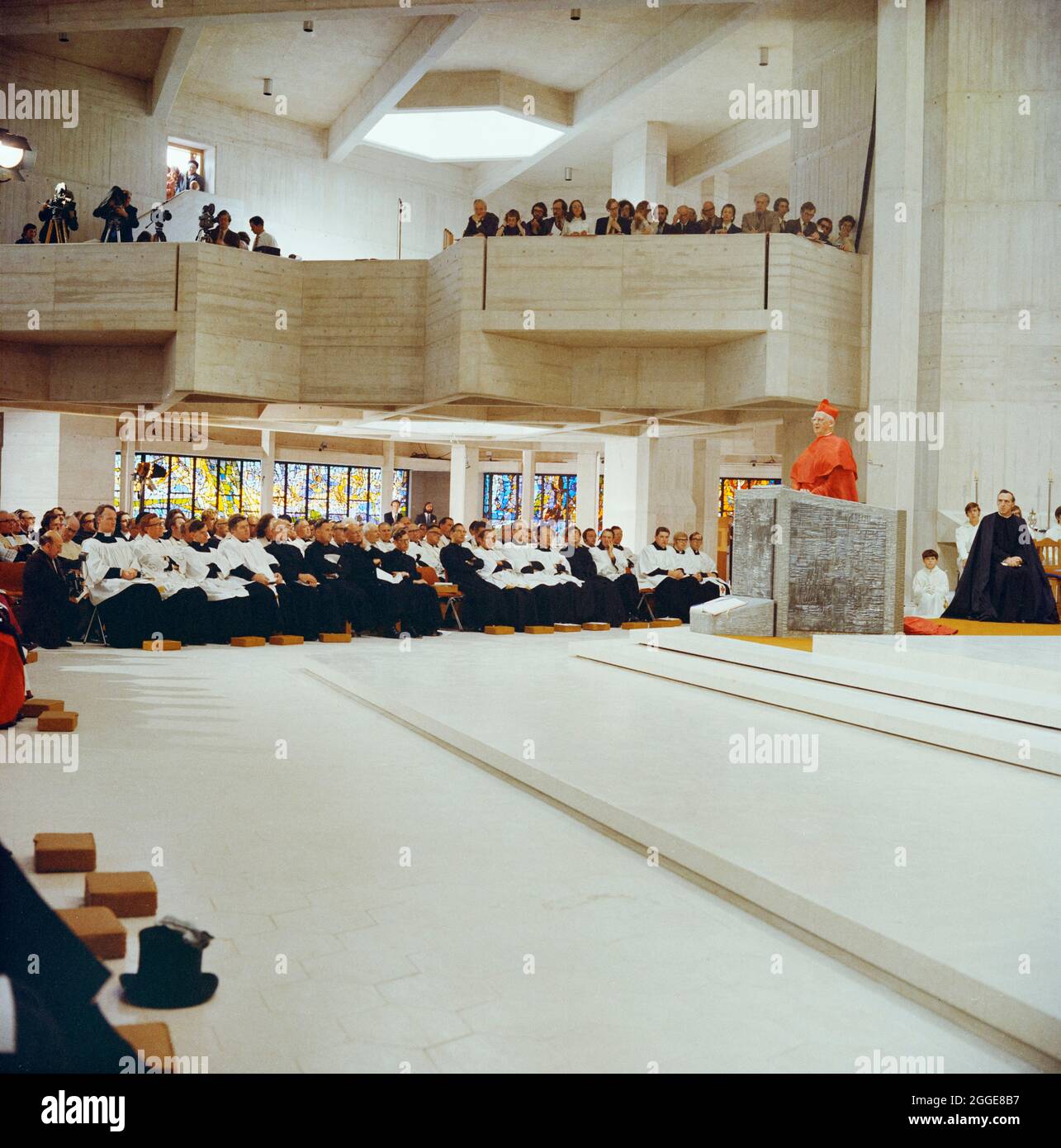 Cardinal John Heenan, Archbishop of Westminster, addressing the congregation in Clifton Cathedral during the consecration ceremony. This Roman Catholic Cathedral was designed by Ronald Weeks, E S Jennett and Antoni Poremba of the Percy Thomas Partnership. It was built by John Laing &amp; Son Limited between 1969-1973 and was constructed using pre-cast concrete panels and in-situ concrete. In 1974 it received the Concrete Award from the Concrete Society. Stock Photo