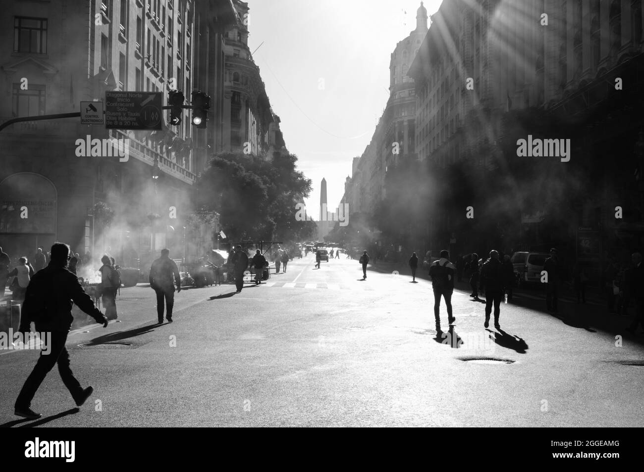 Grayscale of a spreading fog on the street of a city Stock Photo