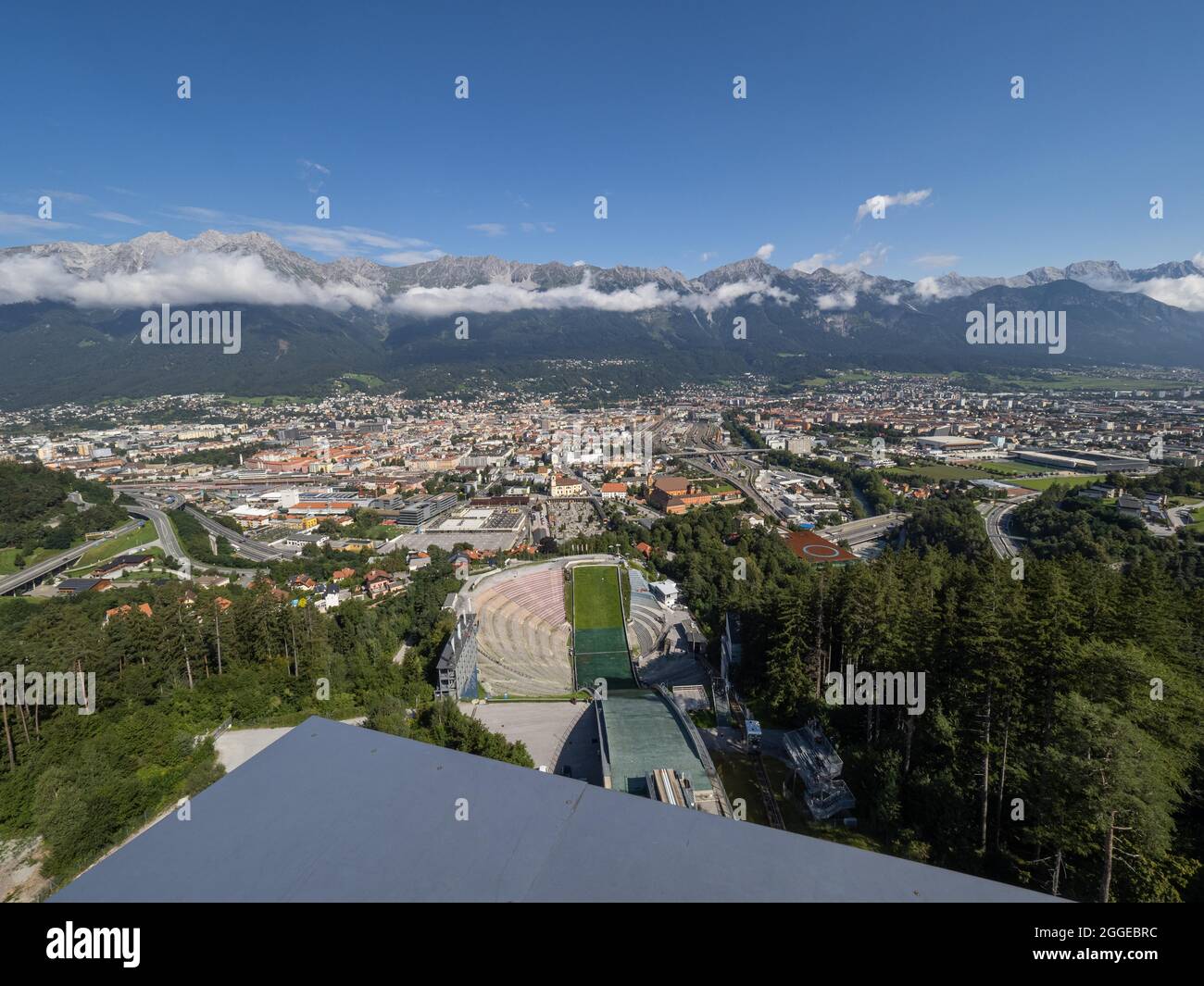 View from the Bergisel ski jump down to the stadium, behind it the city of Insbruck, on the horizon the Nordkette, Innsbruck, Tyrol, Austria Stock Photo