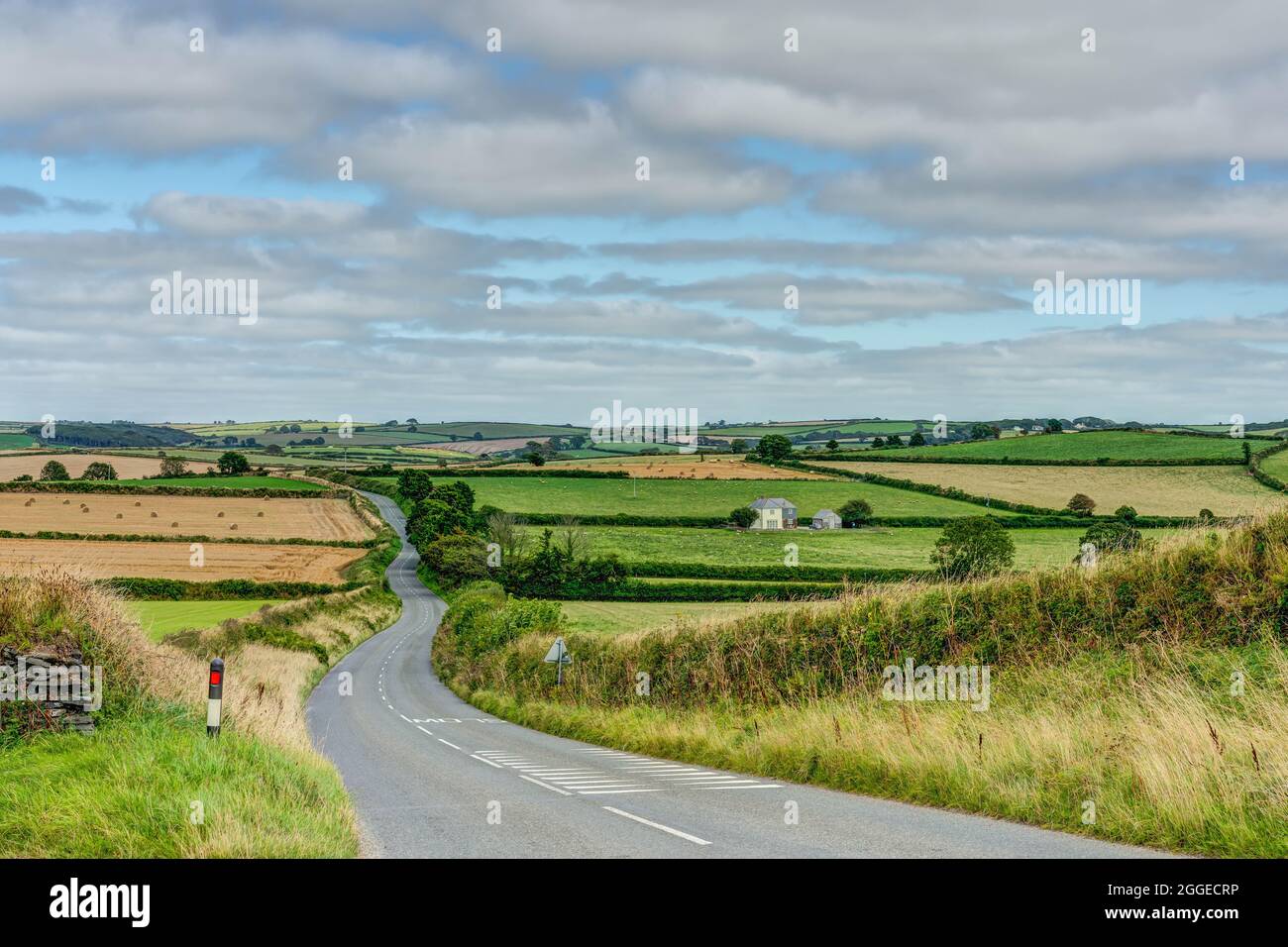 A long winding tarmac road through some of the most beautiful well kept