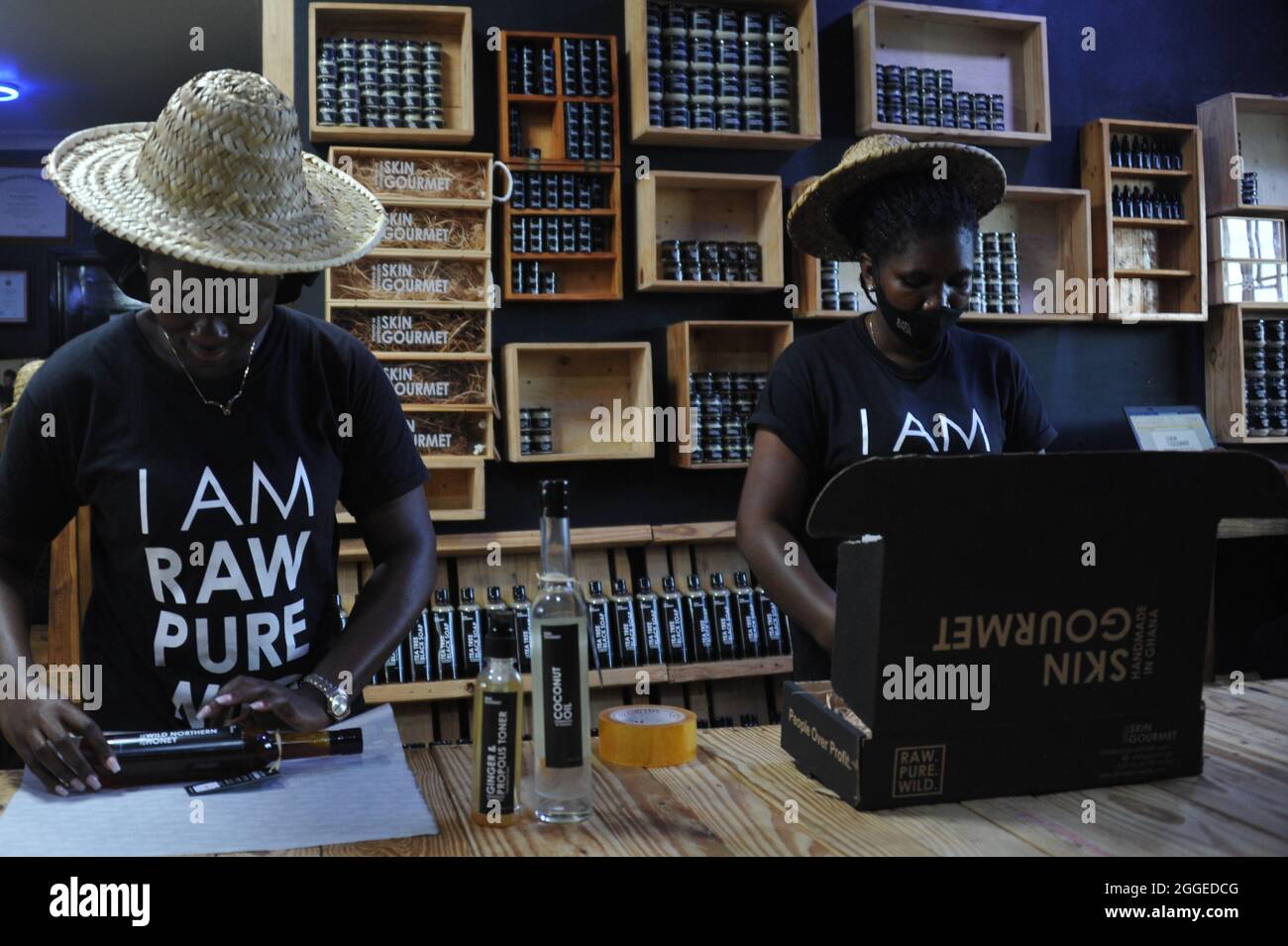 Accra, Ghana. 24th Aug, 2021. Workers pack skincare products in the