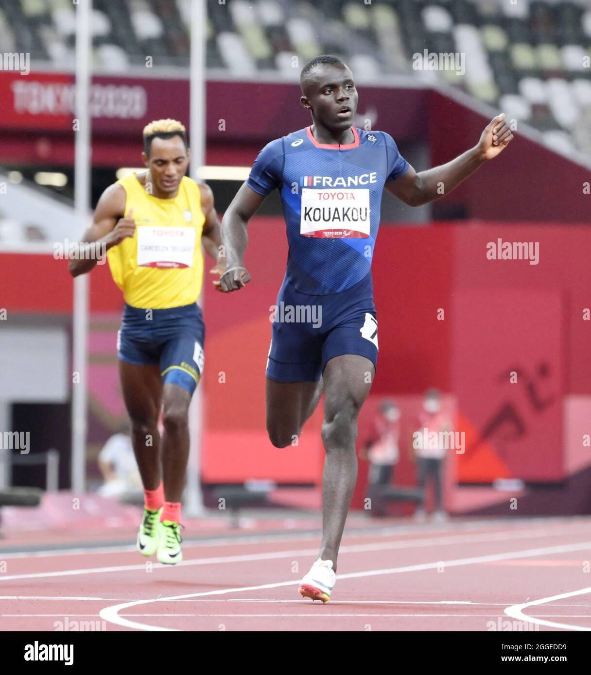 Tokyo, Japan, Aug. 31, 2021, French sprinter Charles-Antoine Kouakou (R ...