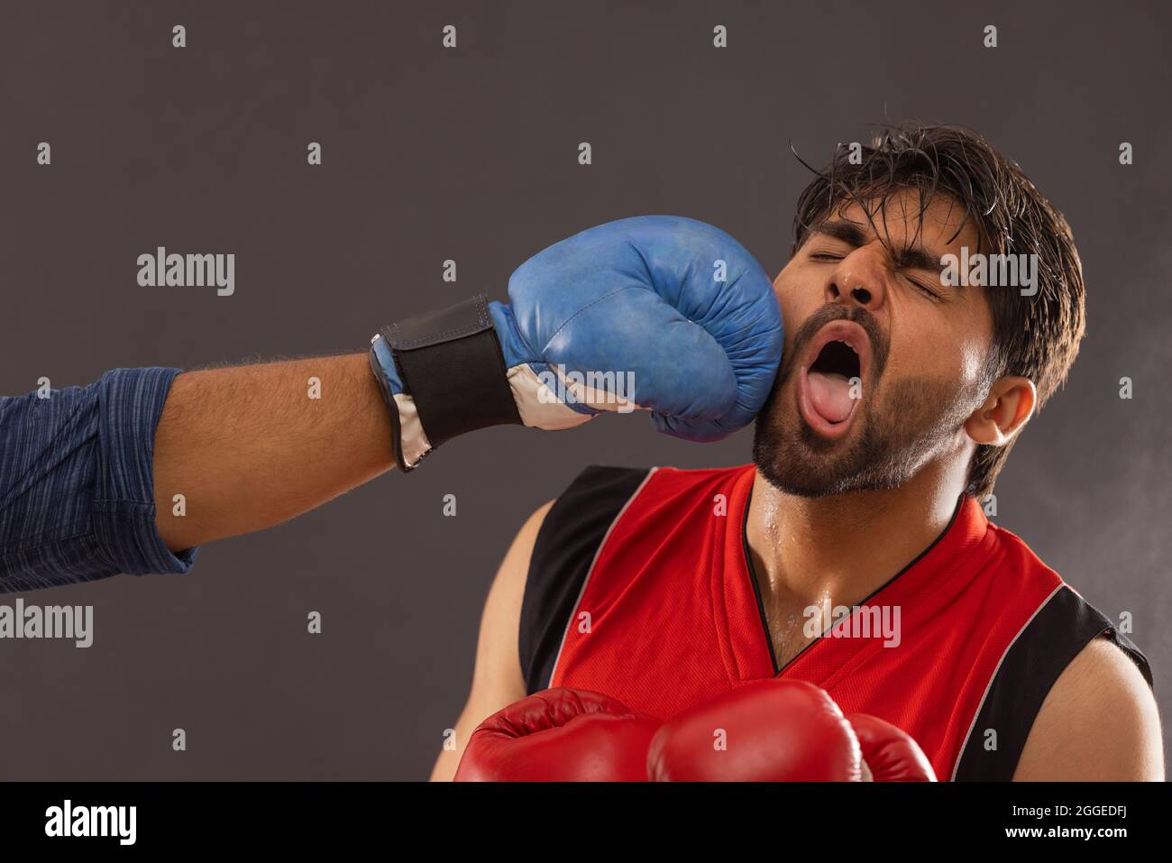A BOXER PUNCHED BY ANOTHER PLAYER WHILE BOXING Stock Photo Alamy
