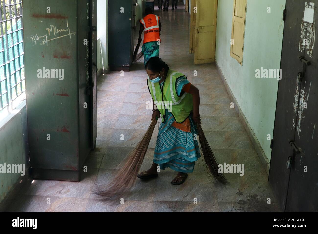 Chennai, Tamil Nadu, India. 31st Aug, 2021. Workers clean the corridor