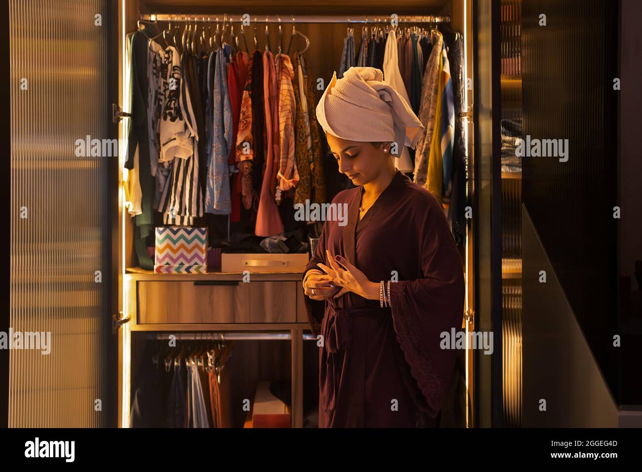 Woman removing her clothes hi-res stock photography and images - Alamy