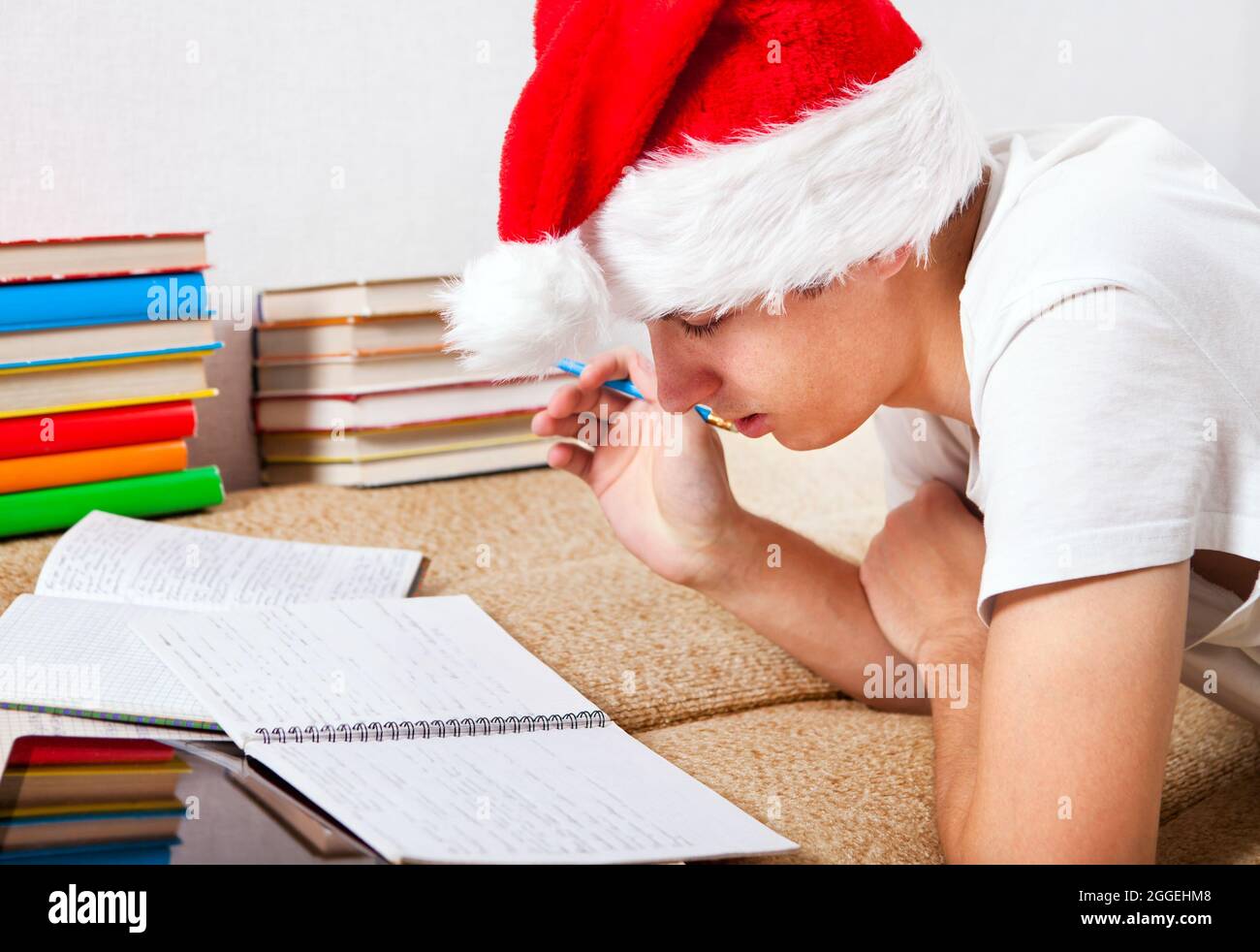 Homework on couch hi-res stock photography and images - Alamy