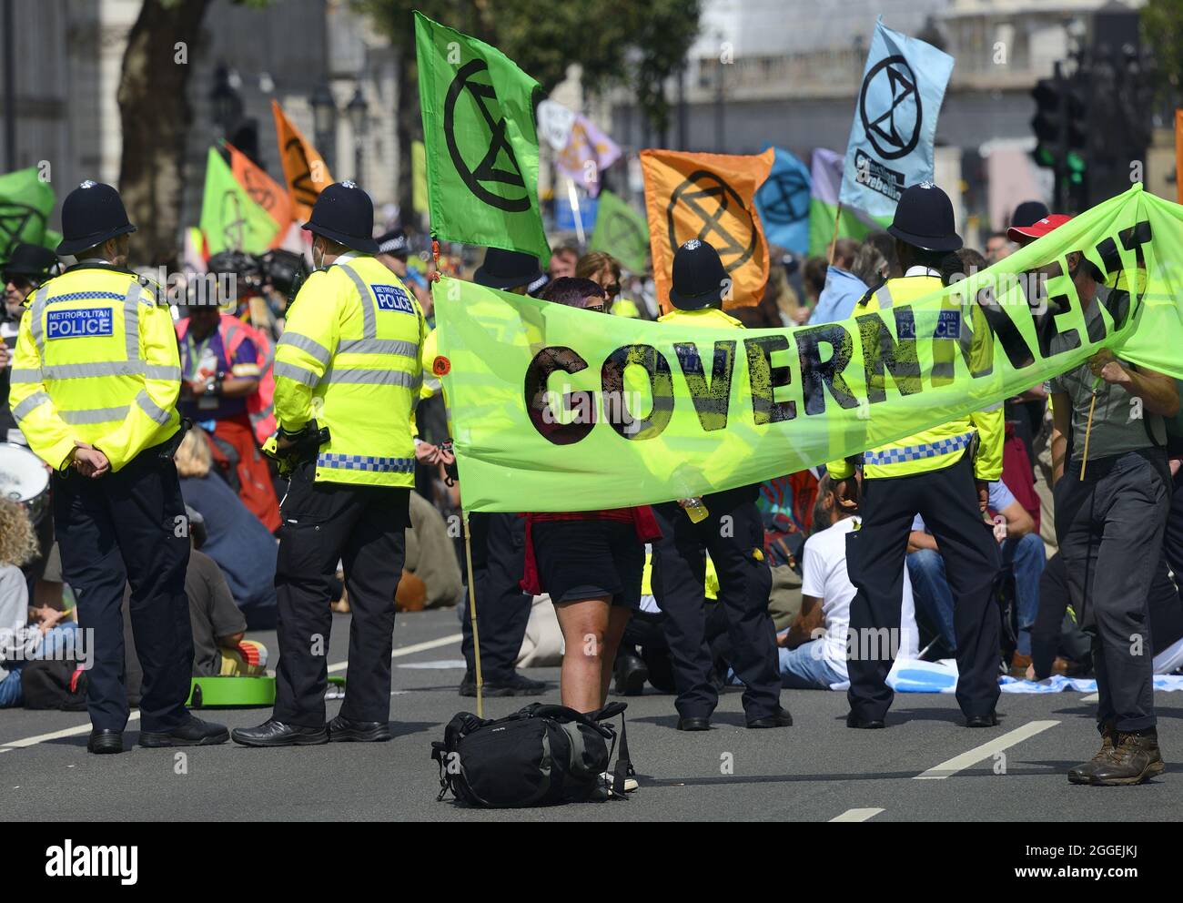 London, UK. Extinction Rebellion climate protest in Parliament Street / Whitehall, closing the street to traffic. 24th August 2021. Stock Photo