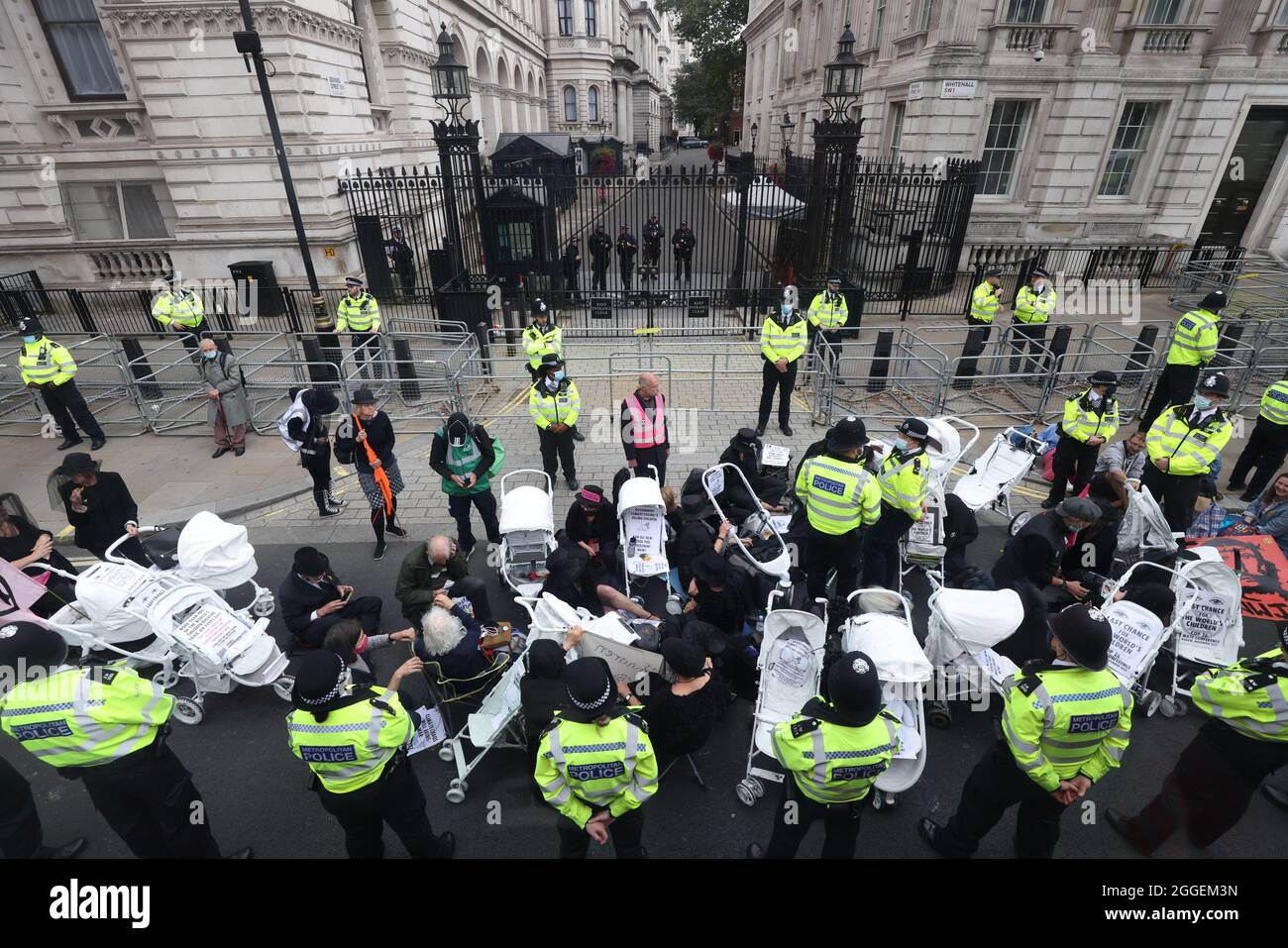 Demonstrators during a protest by members of Extinction Rebellion on Whitehall, near Downing Street, in central London. Picture date: Tuesday August 31, 2021. Stock Photo