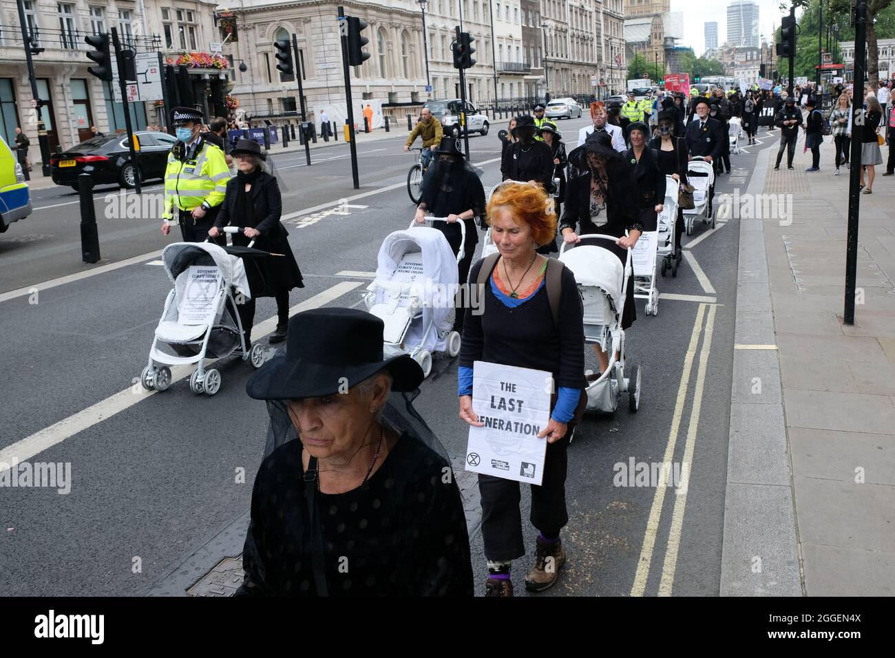 Whitehall, London, UK. 31st August 2021. Members of Extinction Rebellion stage Pram Rebellion Action, marching from Parliament to Trafalgar Square. Credit: Matthew Chattle/Alamy Live News Stock Photo