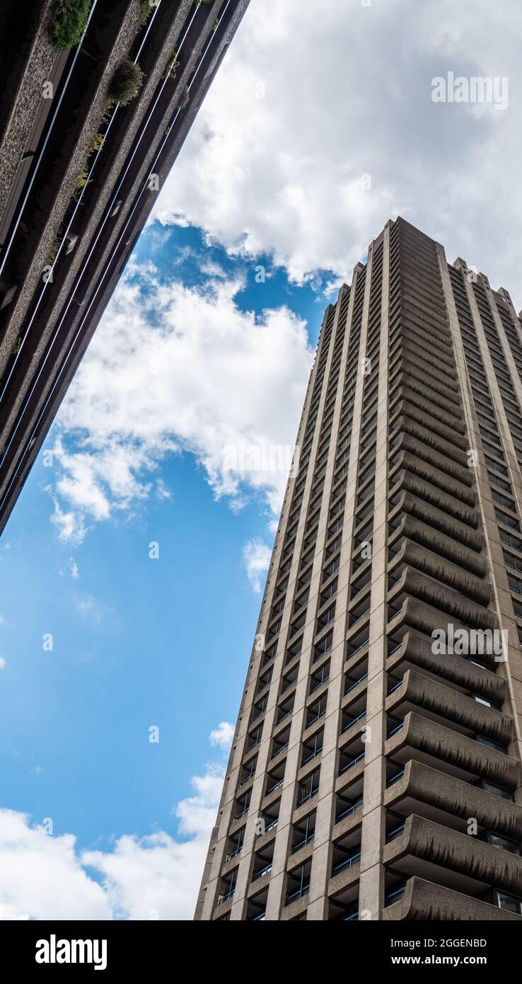 Brutalist Architecture. A low-angle view of the iconic concrete towers of the residential Barbican Estate in the heart of the City of London, EC2. Stock Photo