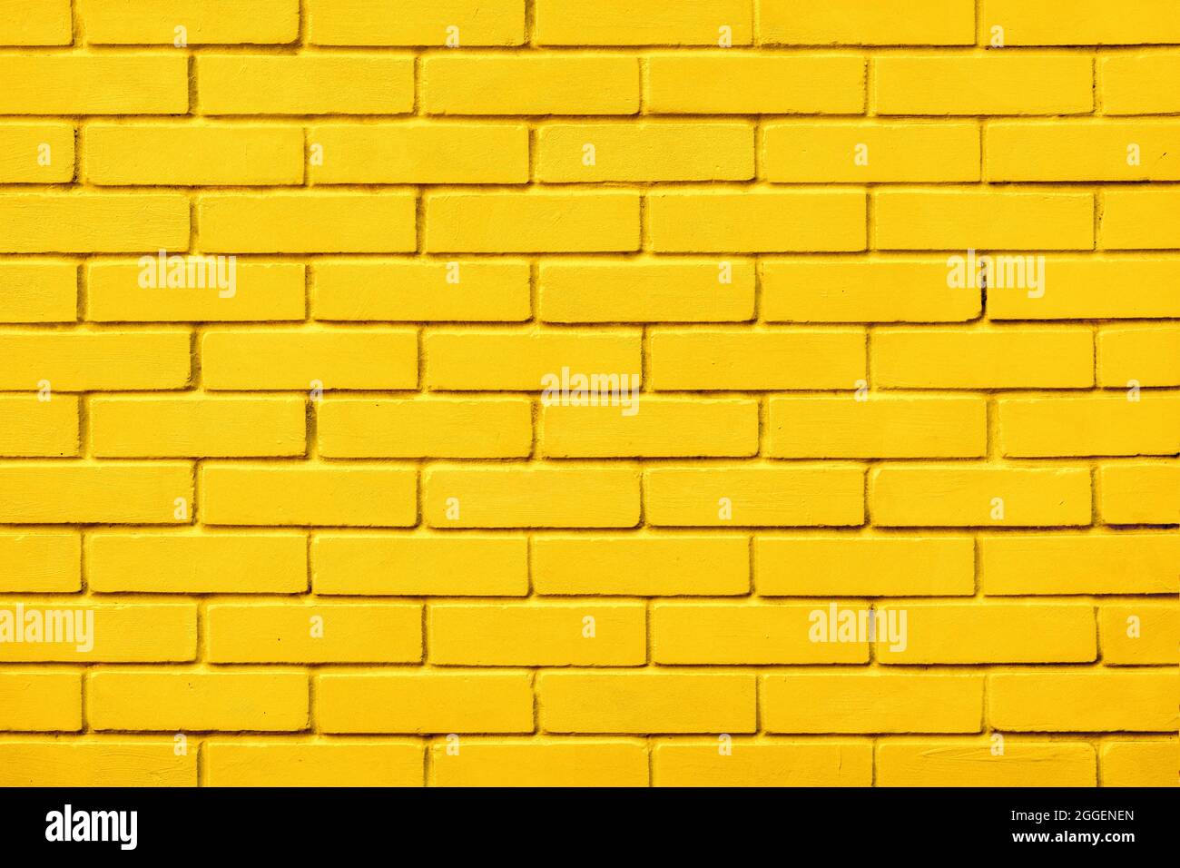 Painted bricks design yellow color wall background blocks. Natural design texture background yellow brick wall color paint block pattern. Block Stock Photo