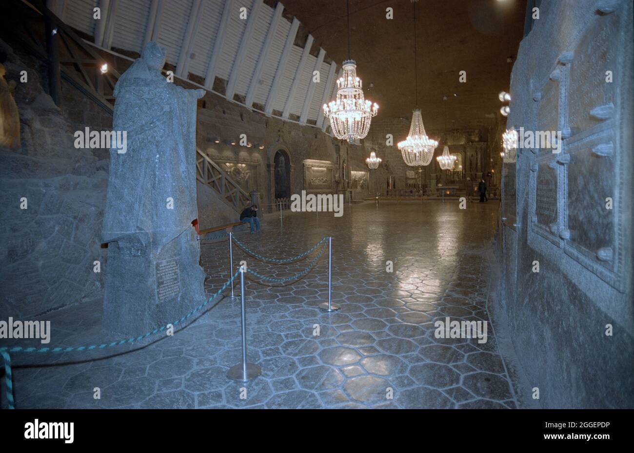 St. Kinga's Chapel in the Wieliczka Salt Mine (Polish: Kopalnia soli Wieliczka), in the town of Wieliczka, southern Poland, lies within the Kraków metropolitan area. From Neolithic times, sodium chloride (table salt) was produced there from the upwelling brine. The Wieliczka salt mine, excavated from the 13th century, produced table salt continuously until 2007, as one of the world's oldest operating salt mines. Throughout its history, the royal salt mine was operated by the Żupy Krakowskie (Kraków Salt Mines) company. Due to falling salt prices and mine flooding, salt mining was discontinued Stock Photo