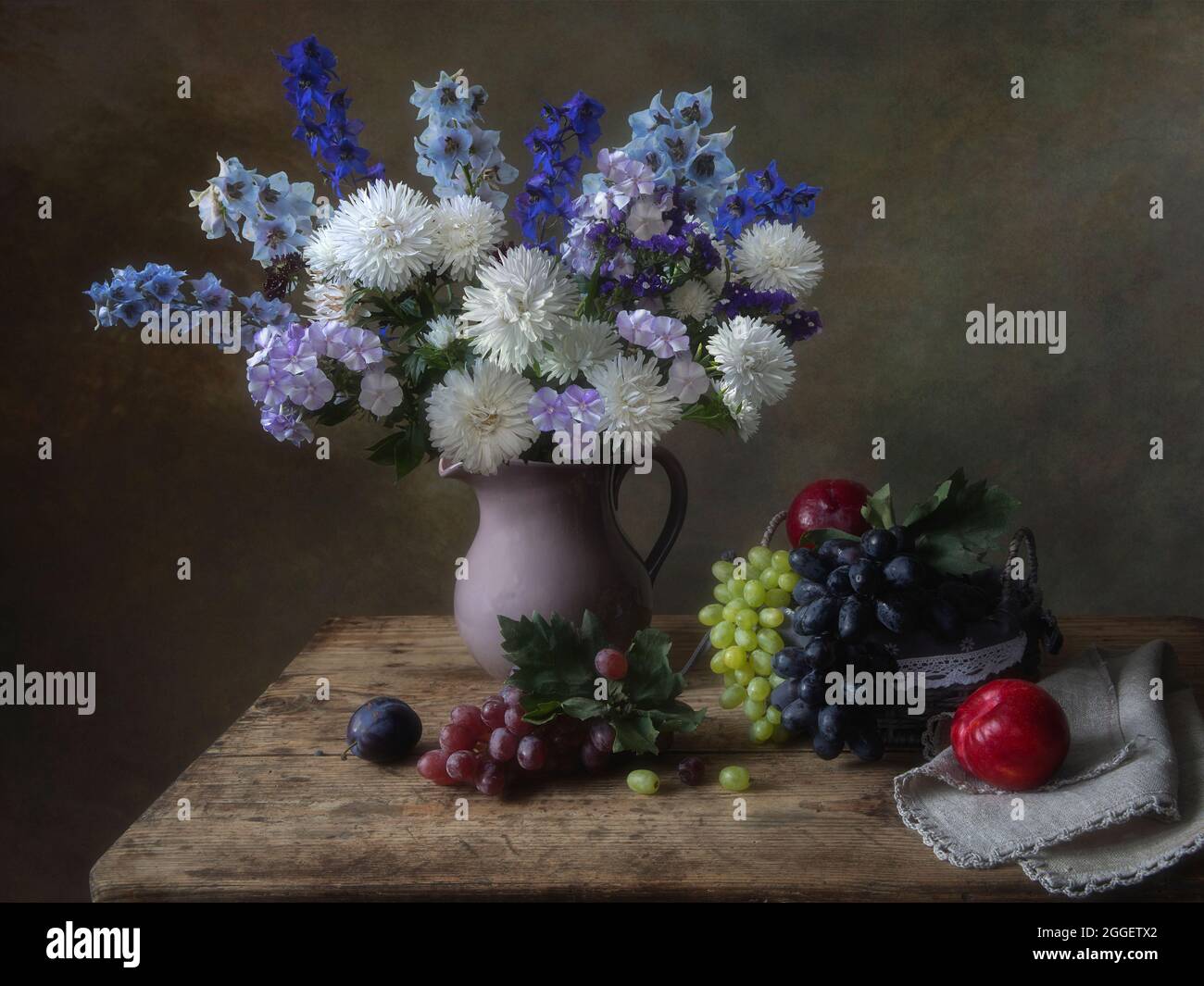 Still life with splendid bouquet and fruits Stock Photo - Alamy