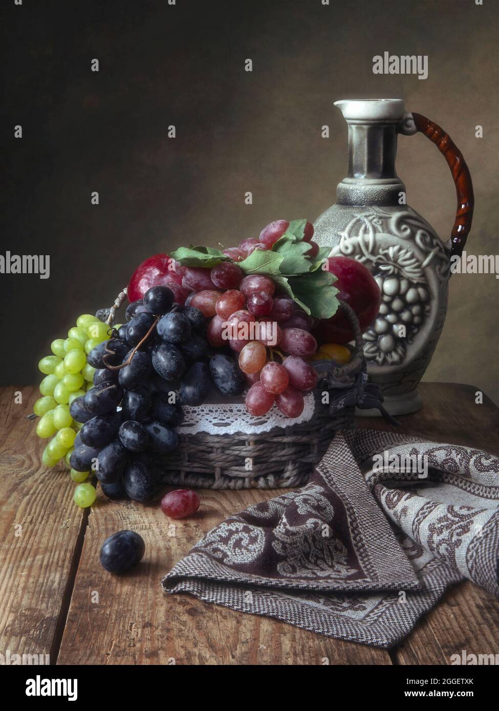 Still life with grapes and wine jug Stock Photo - Alamy
