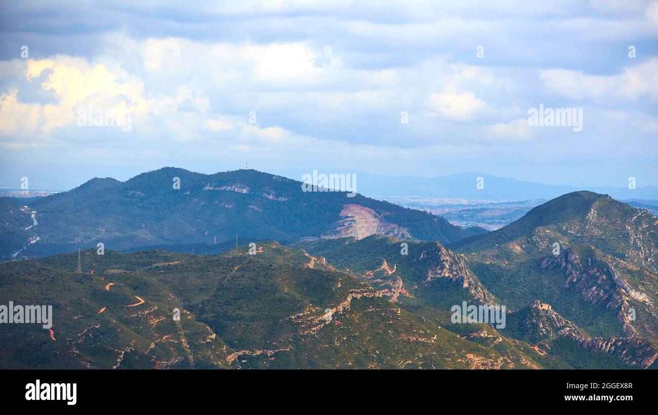Breathtaking view to Montserrat mountain range on a sunny summer day near Barcelona, Catalonia, Spain Stock Photo