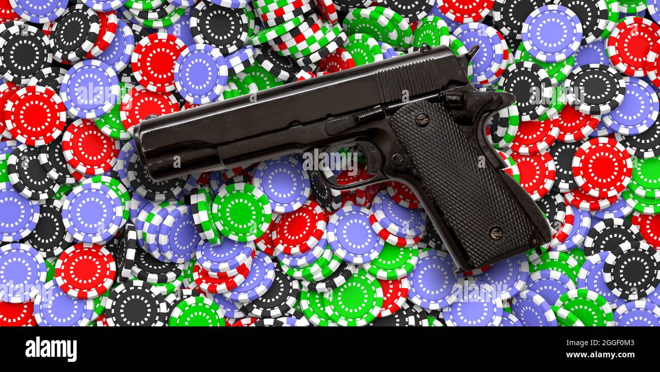 Pistol on poker chips background. Casino betting and gambling