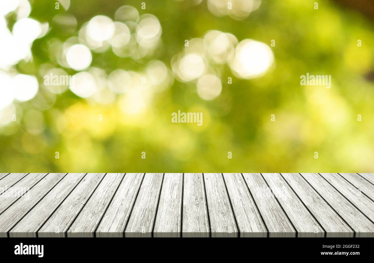 White wooden table on outdoor forest blurred background, assembly, product display exhibition. Stock Photo