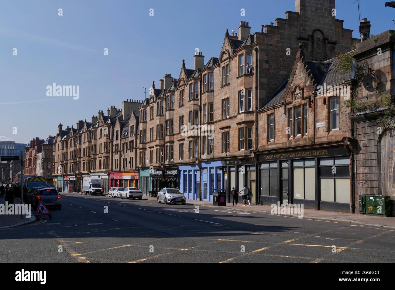 traditional housing flats above shops in Saltmarket, Glasgow city centre, Scotland,UK Stock