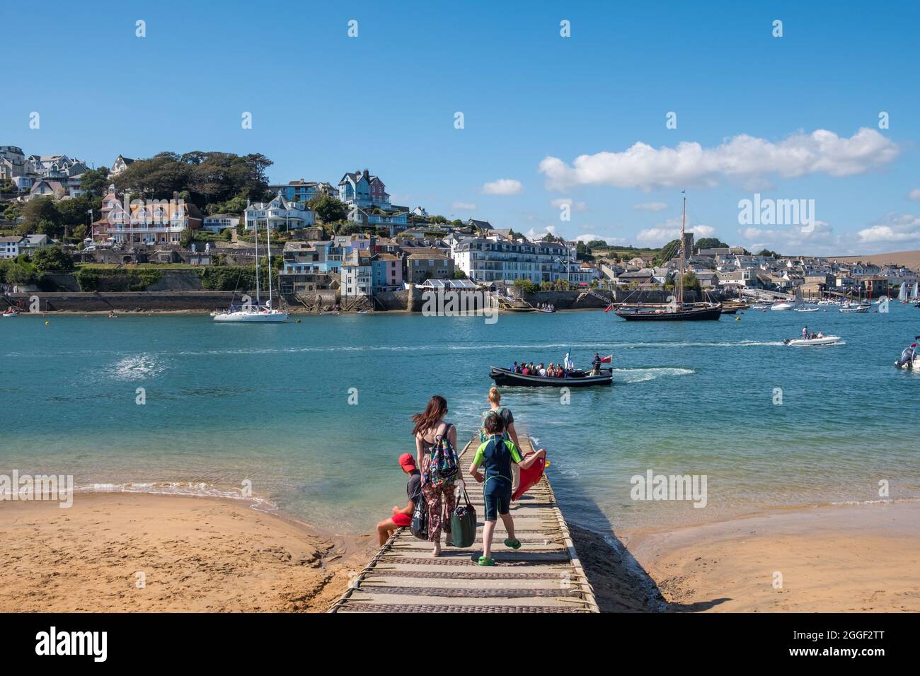 Foot passengers waiting for the Salcombe to East Portlemouth Ferry on a sunny summer's day Stock Photo