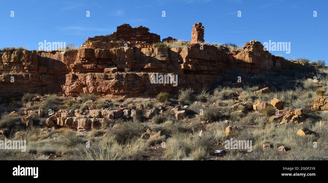 Valley with amazing Pueblan Lomaki red rock ruins. Stock Photo