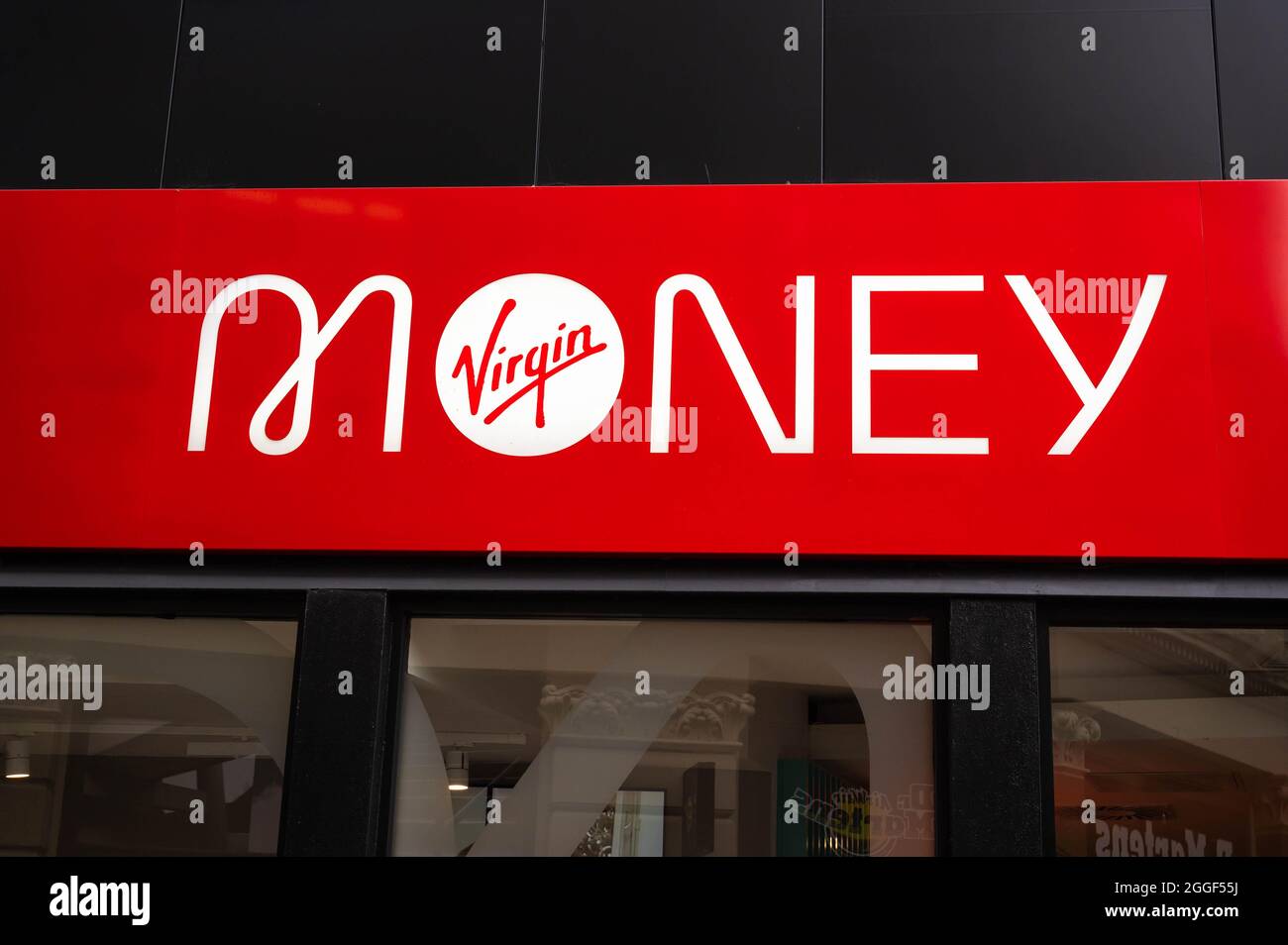 A view of the Virgin money logo above the branch entrance in Castle Street Norwich Stock Photo