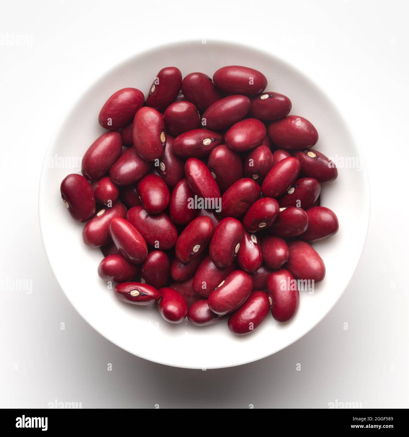 macro Close-up of Organic Rajma, (Laal Lobia ) or red kidney beans dal inside a ceramic white bowl. Top view Stock Photo