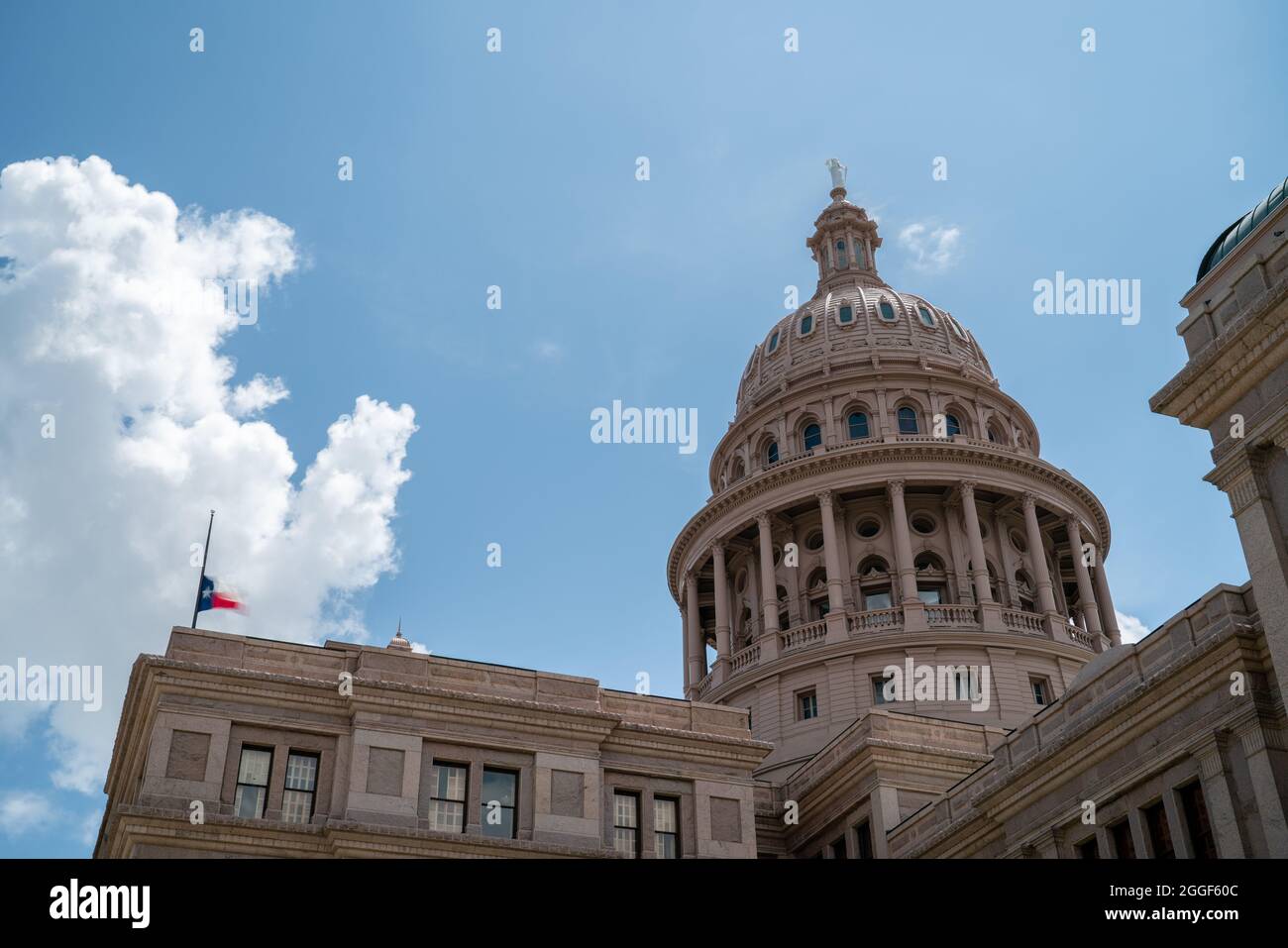 View of the Top of the Austin Capitol Building with Flag HalfStaff