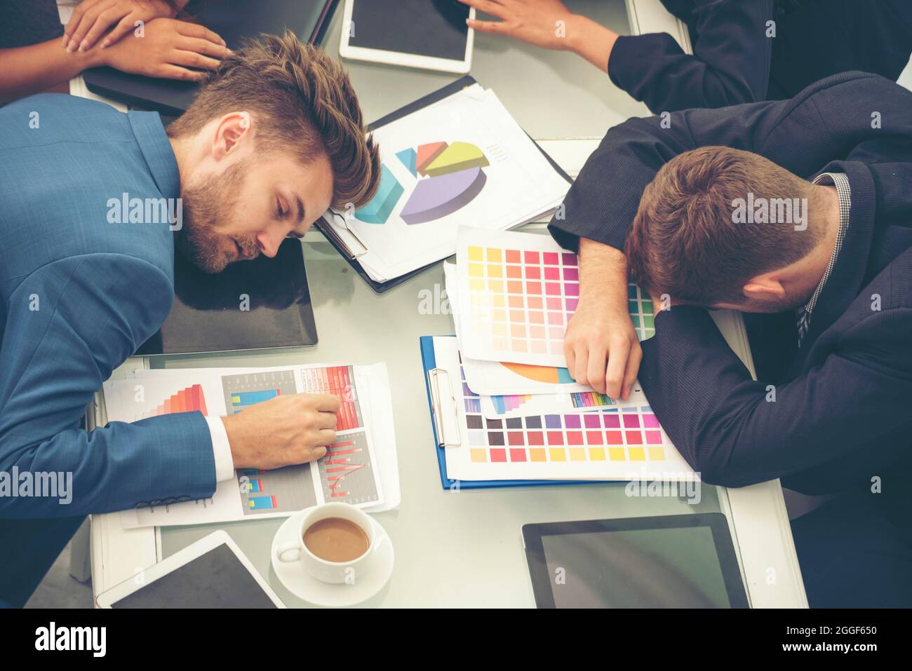 Worker lazy person sleep exhausted with tired meeting. Diversity group of business people sleeping in conference room after meeting. Executive boss an Stock Photo