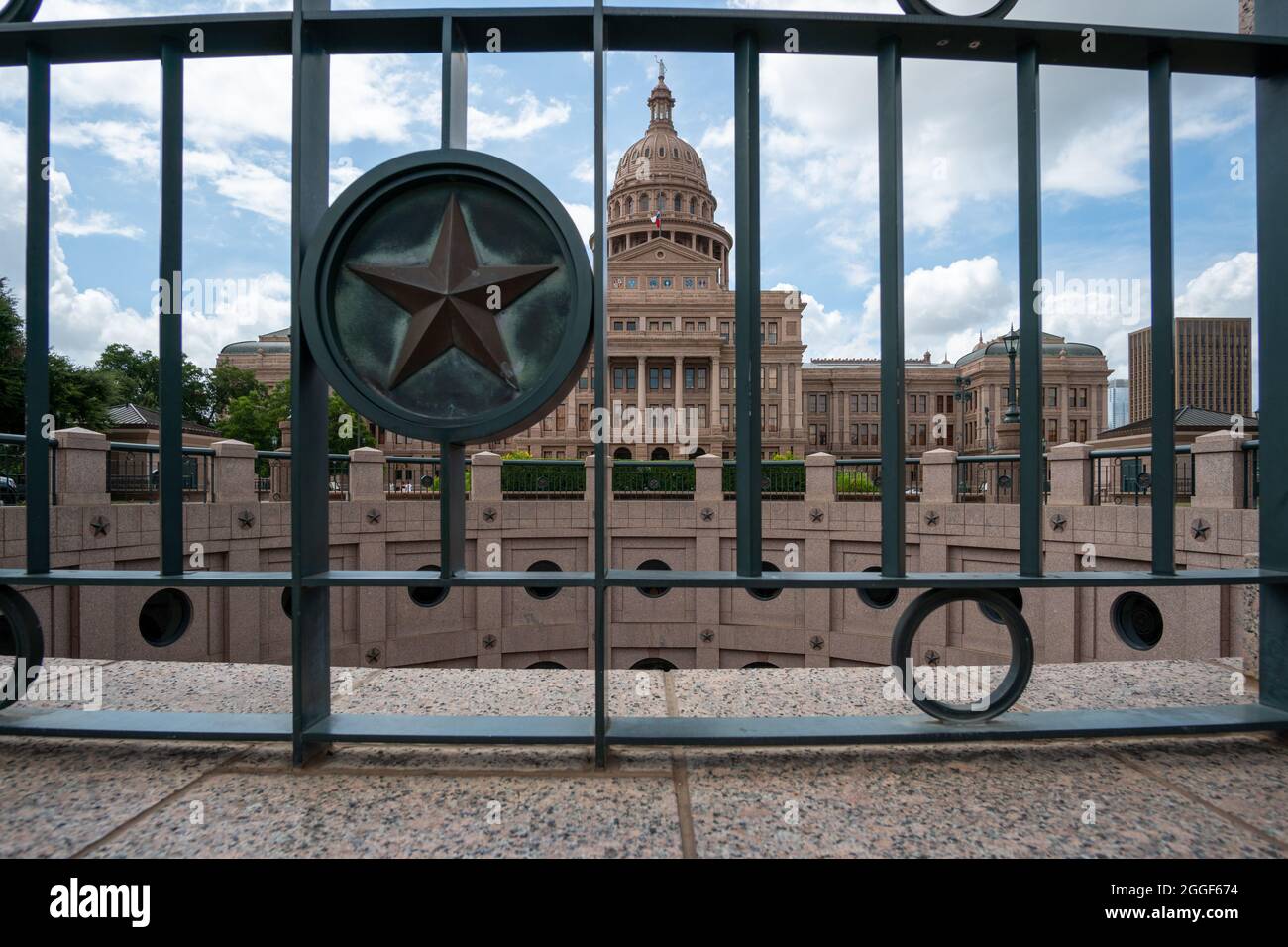 Capitol Railing View of the Texas State Capitol Through Iron Railing with Lone Star ...