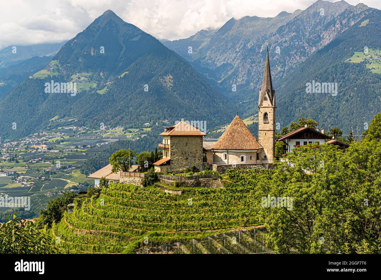 St. George's Church in Schenna, South Tyrol, Italy. Hotel Hohenwart offers its guests regular hikes in the surrounding mountains Stock Photo