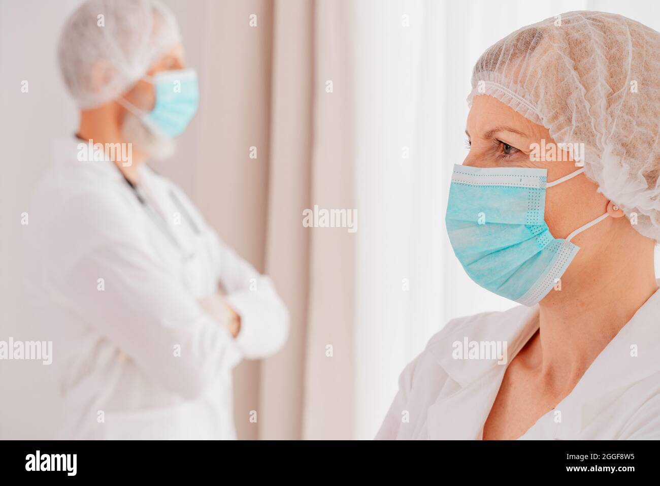doctors with face mask think are ready to work Stock Photo