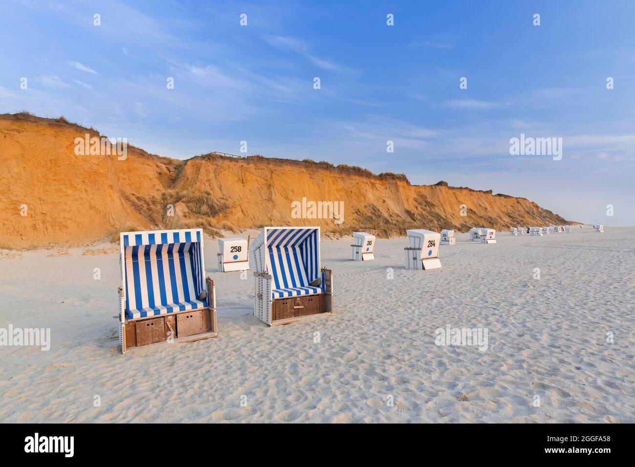 Roofed wicker beach chairs at the Rotes Kliff / Rote Kliff, sea cliffs near Kampen on the German North Sea island Sylt, Schleswig-Holstein, Germany Stock Photo